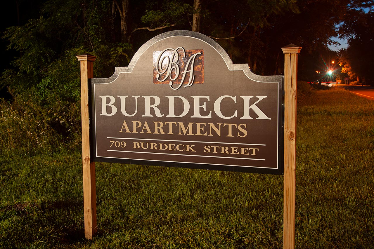 Burdeck Street Apartments exterior, sign, night